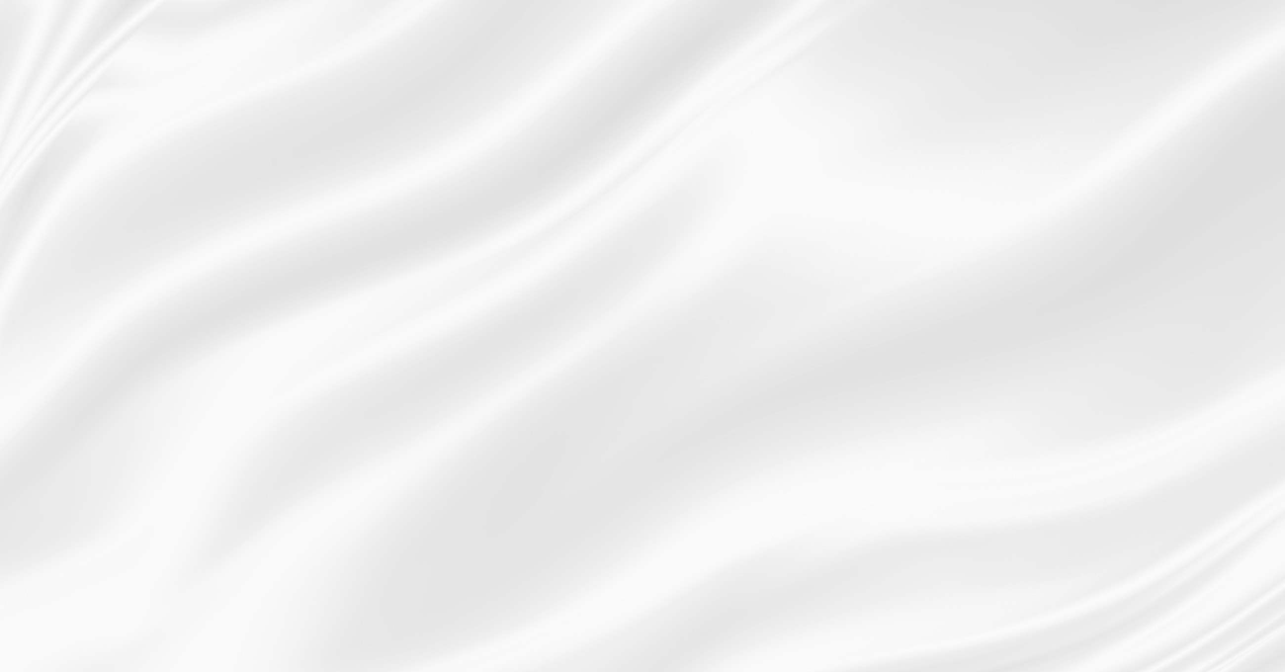 Flowing white silk fabric background texture.