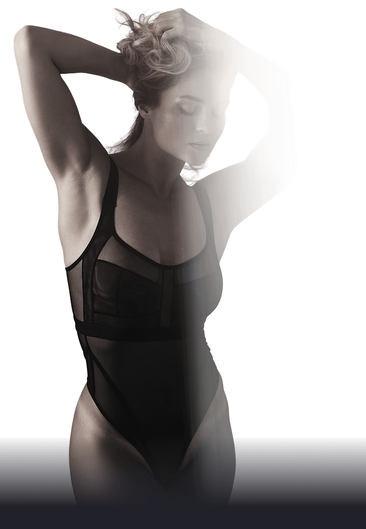 Model posing in stylish black bodysuit.