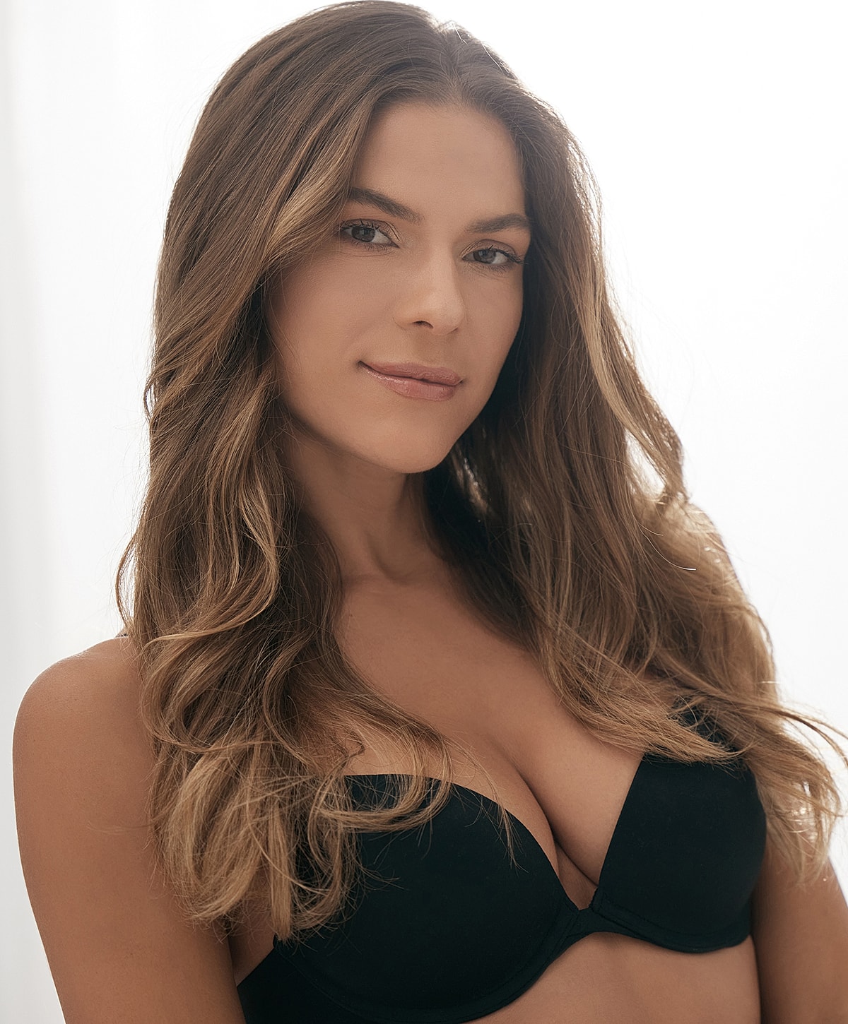 Portrait of a woman in black lingerie.