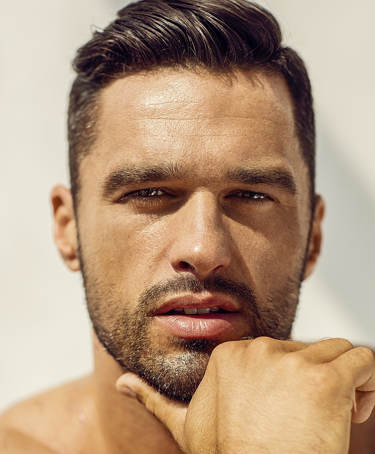 Close-up of a man with styled hair.