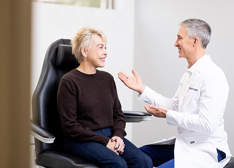 Doctor consulting with patient in medical office.