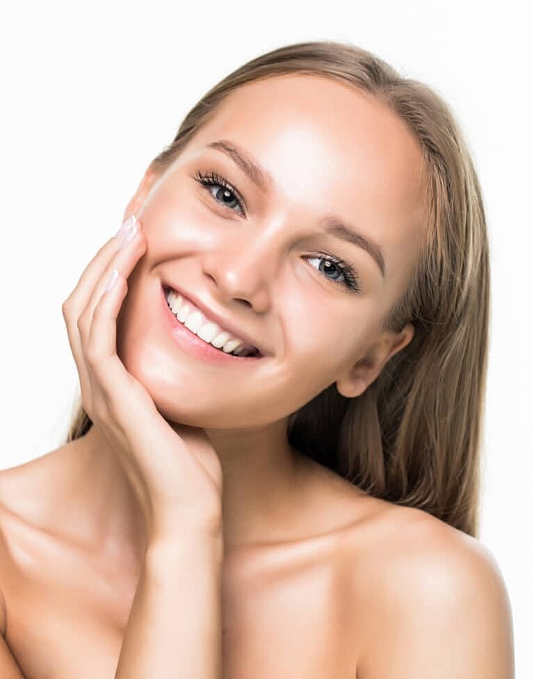 Smiling woman with clear skin and long hair