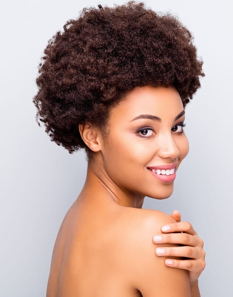 Smiling woman with natural curly hairstyle