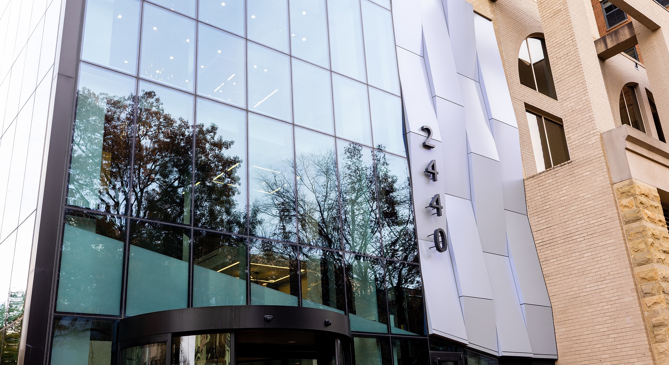 Modern building facade with large glass entrance.