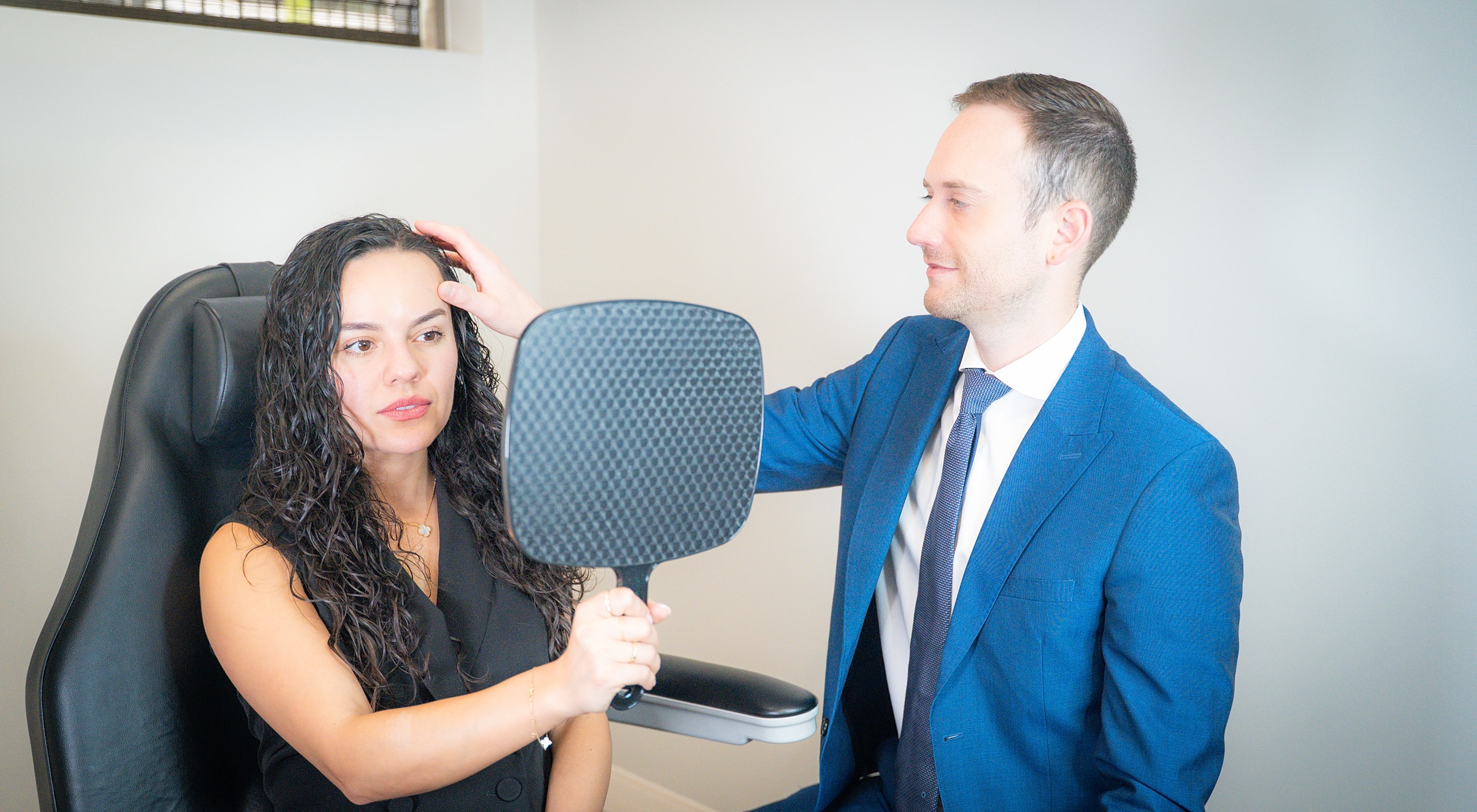 Hair consultation in a professional setting.