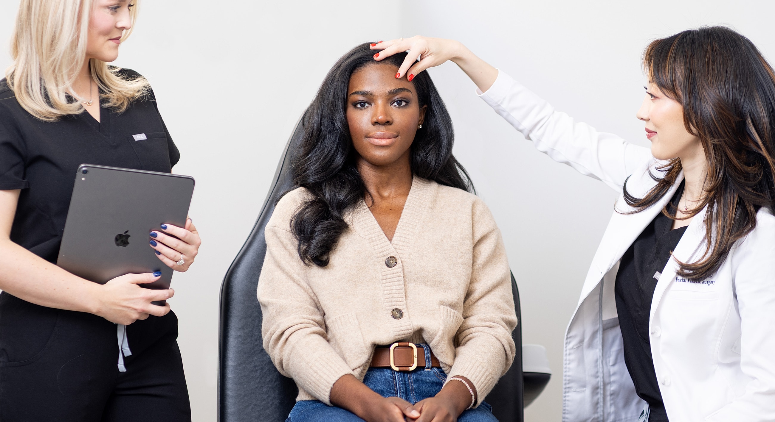 Consultation for beauty treatment with two professionals.