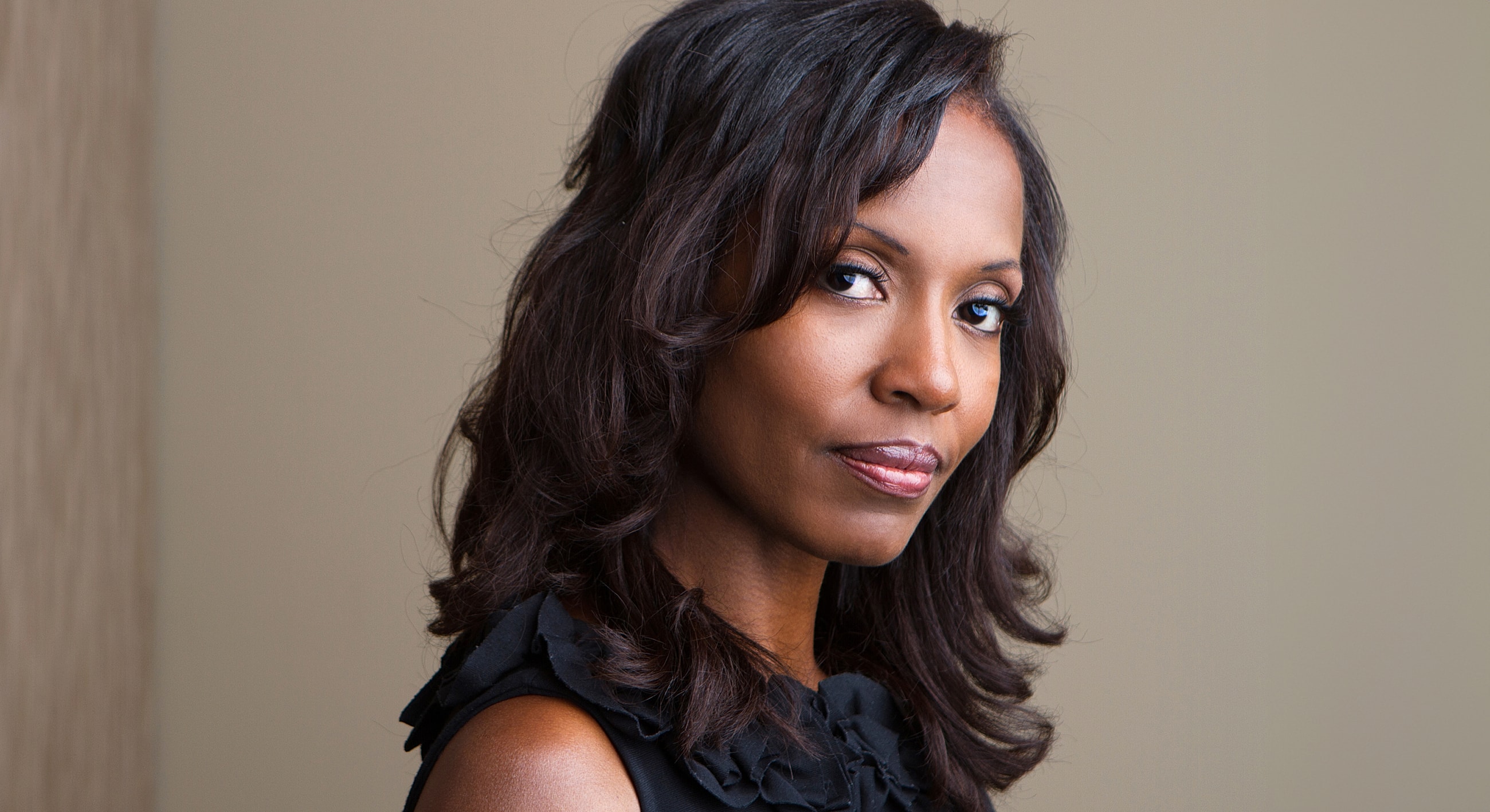 Portrait of a woman with long, dark hair.