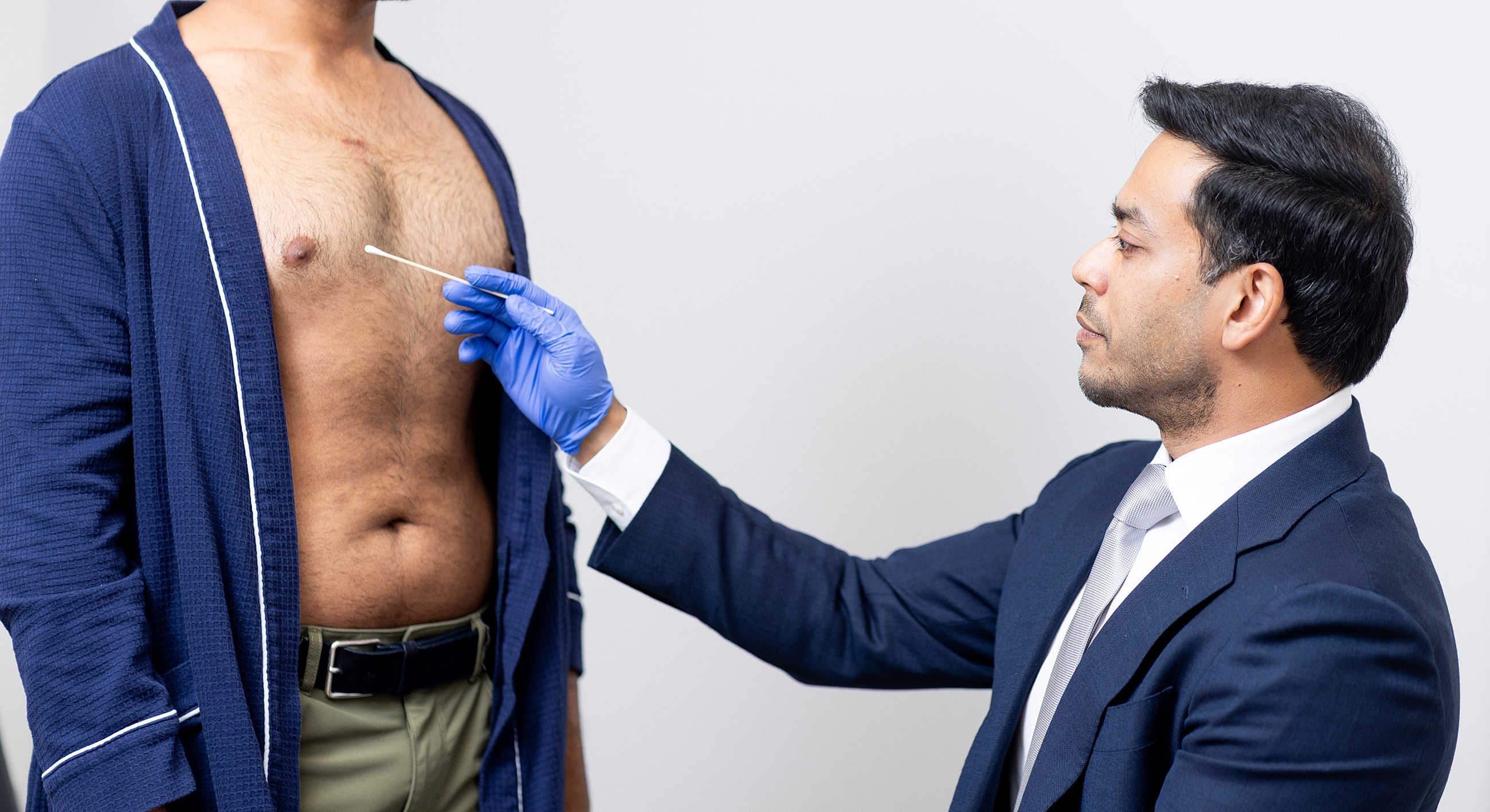 Medical professional conducting a skin examination.