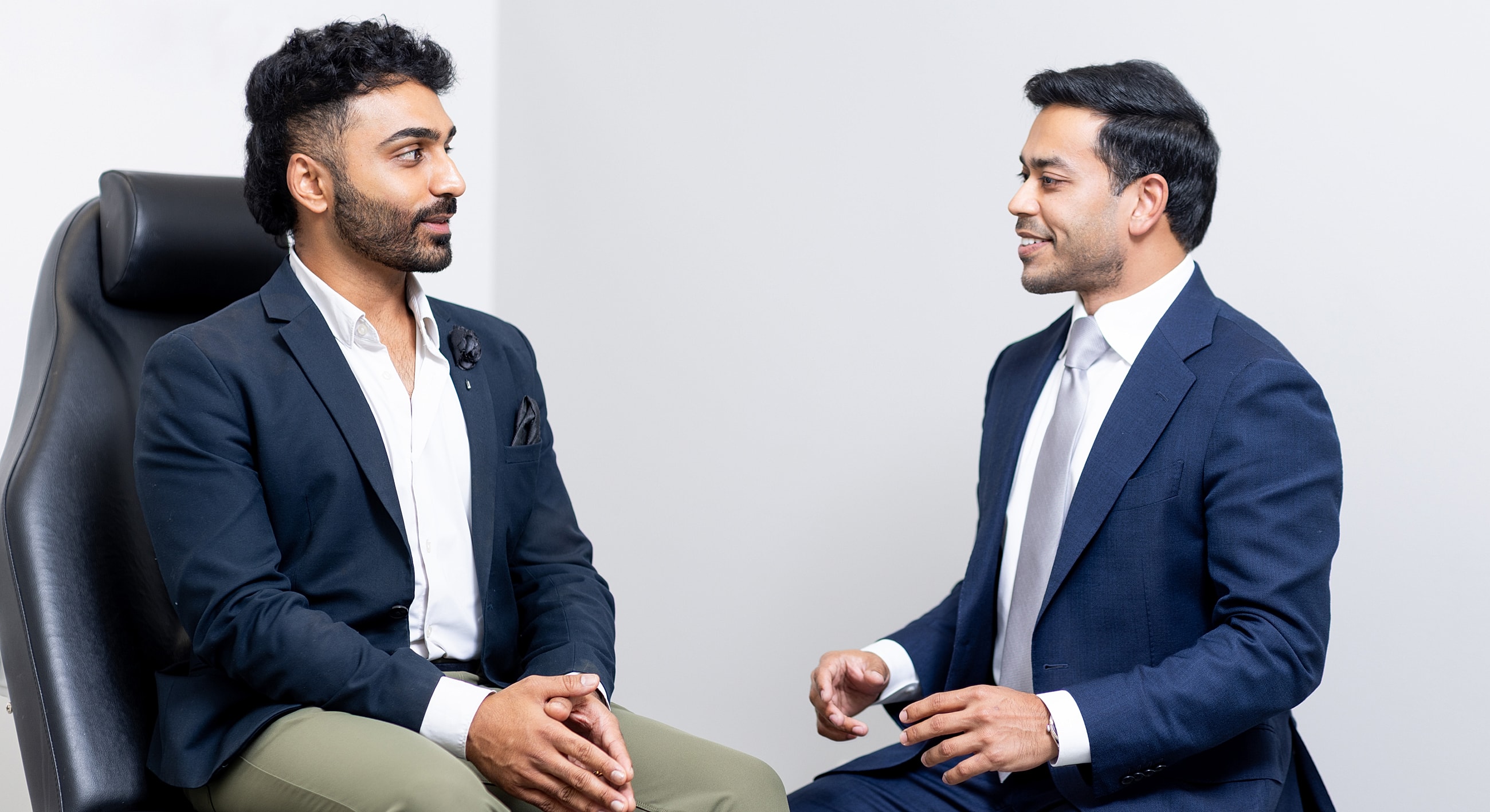 Two men engaged in a conversation.