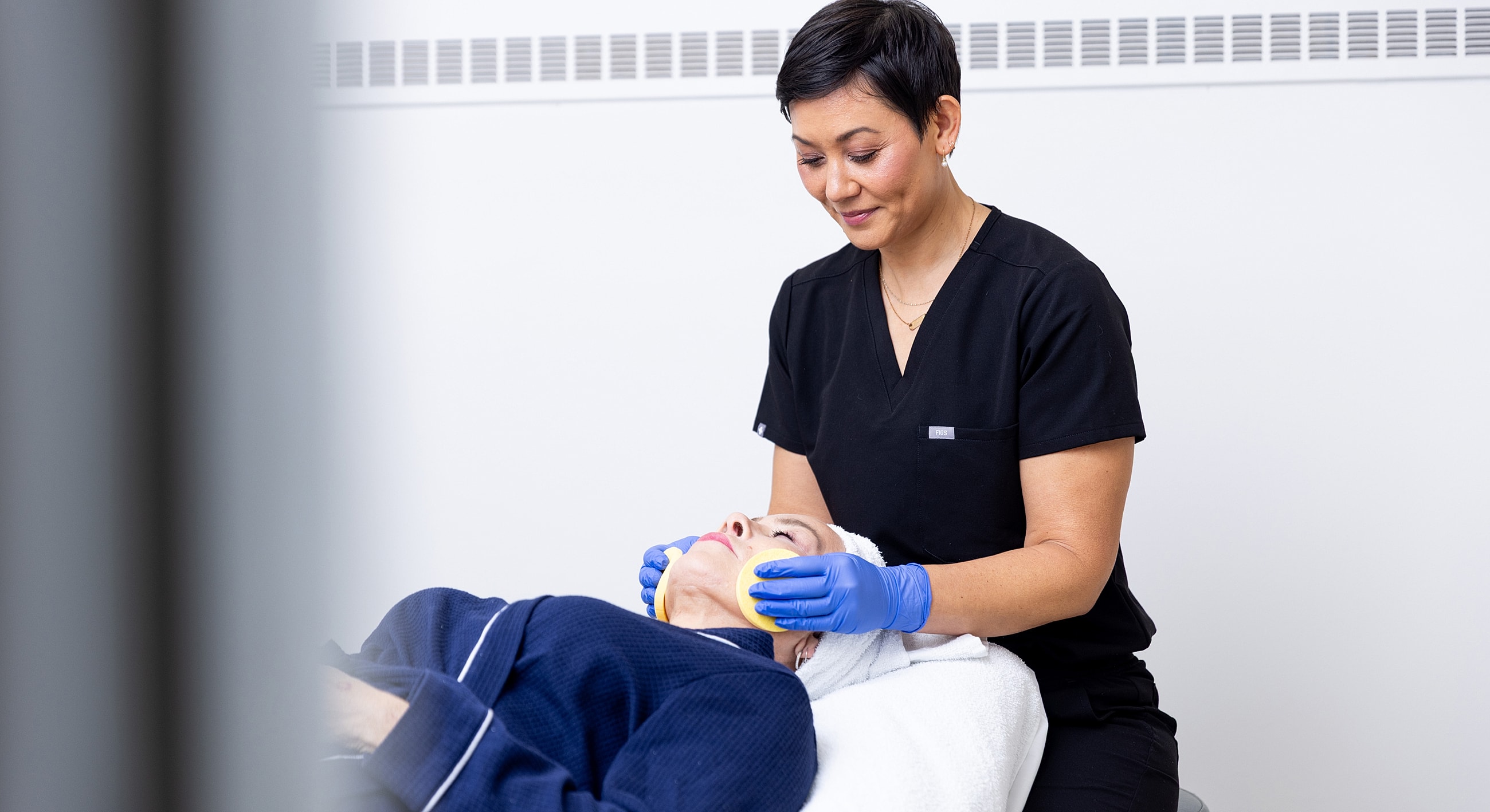 Facial treatment session in a skincare clinic.