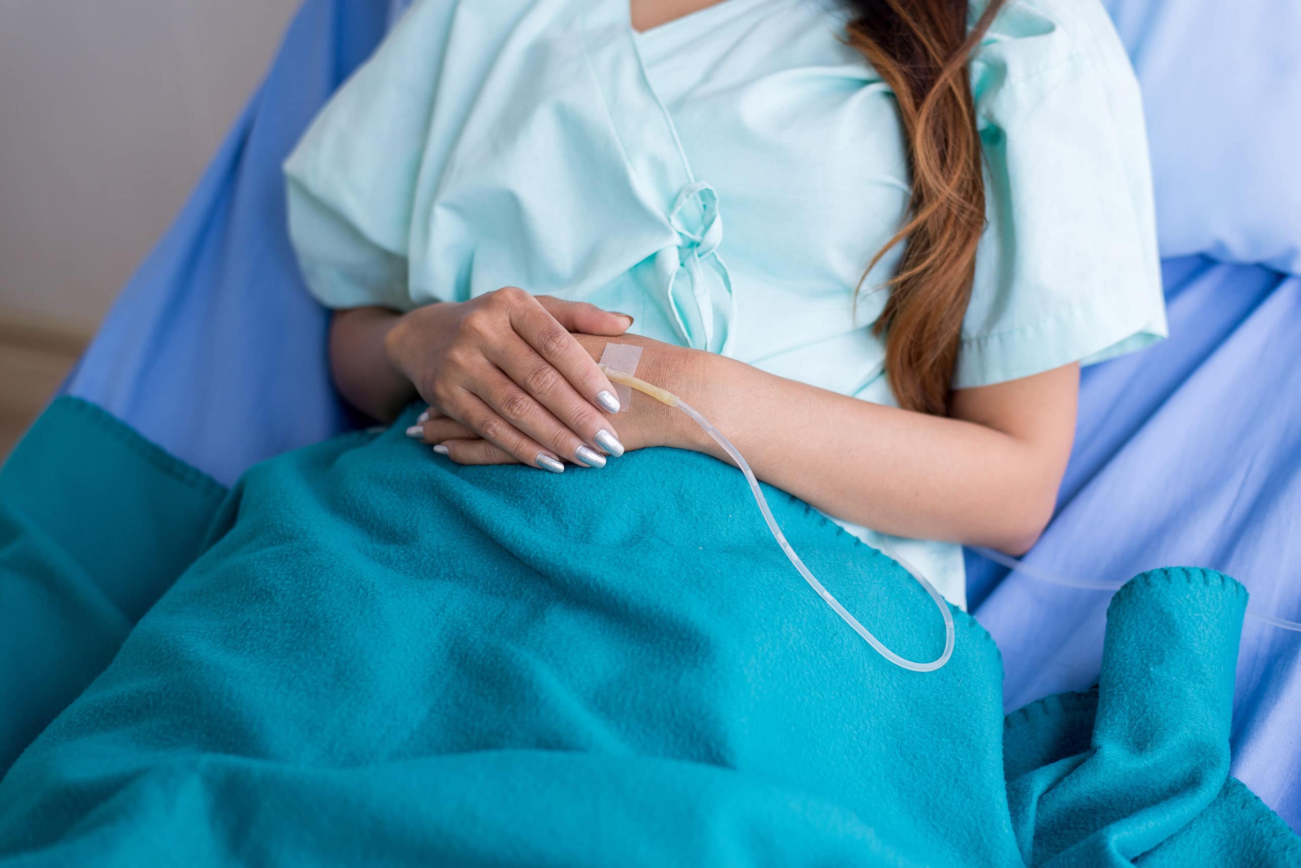 Hand patient woman receiving with saline solution and treatment in a hospital,Close up Hand patient woman receiving with saline solution and treatment in a hospital,Close up