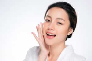 Beautiful Young Woman with Clean Fresh Skin. Face care . Facial treatment . Cosmetology , beauty and spa. Asian women portrait
