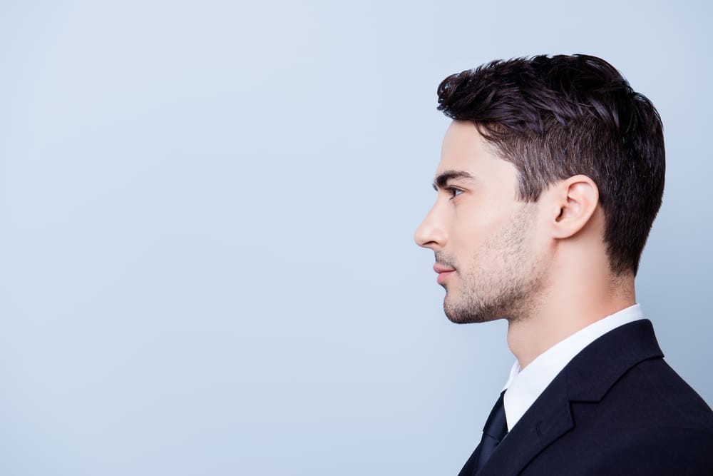 Side profile of handsome man from male plastic surgery in Washington, DC
