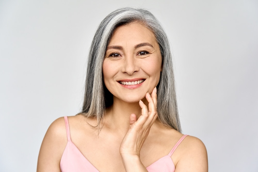 Woman over 50 looking happy and beautiful after menopause makeover in Washington, DC
