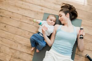 New mom laying down, working out, wanting post-pregnancy tummy tuck in Washington, DC